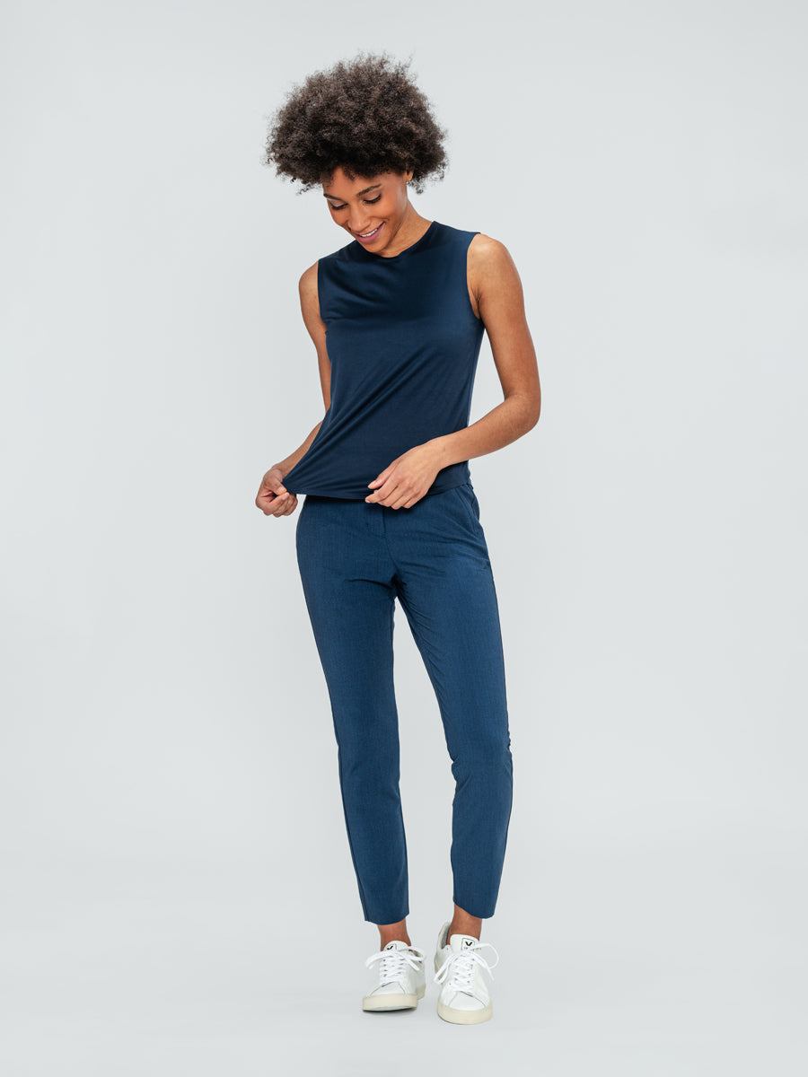 Women's Indigo Luxe Touch Tank and Indigo Heather Velocity Pant on model looking down