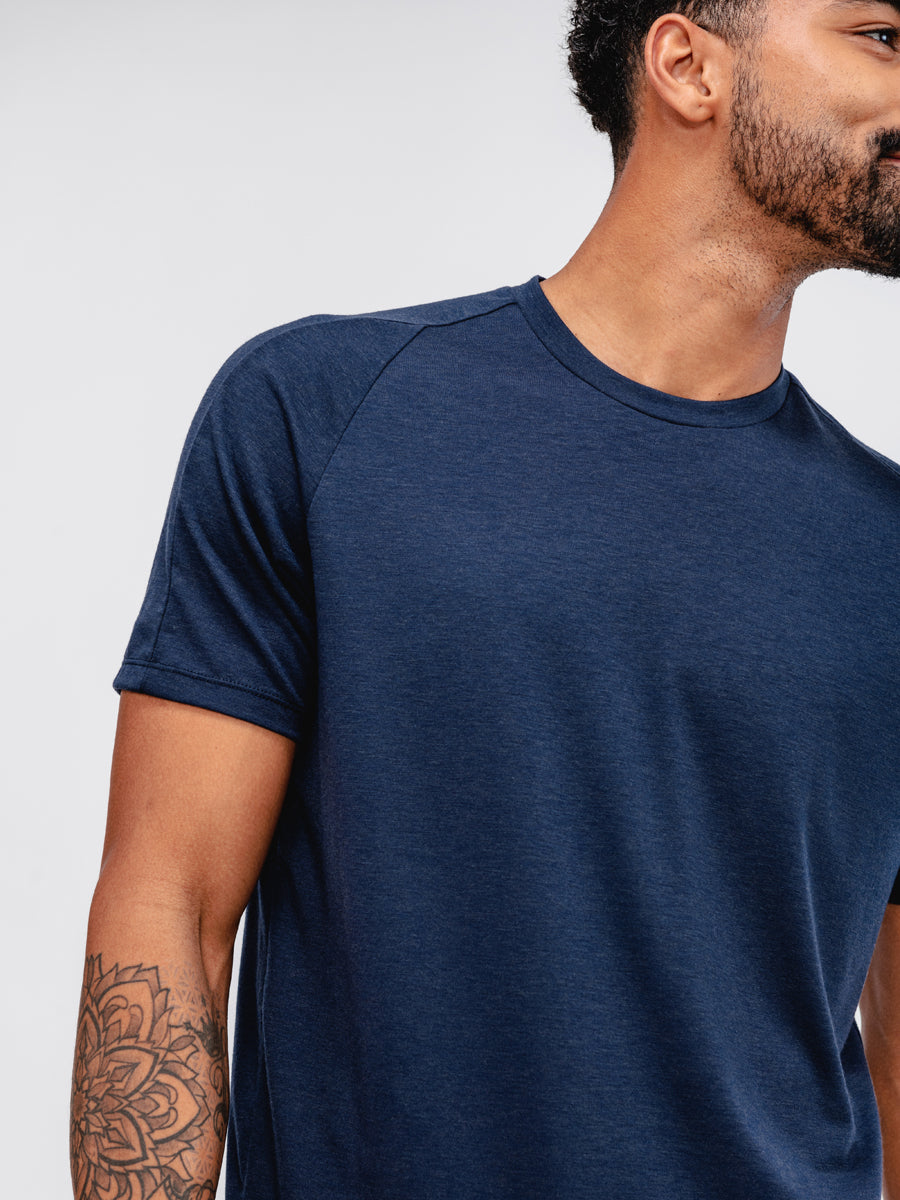 close up of sleeve of Men's Navy Composite Merino Active Tee on model