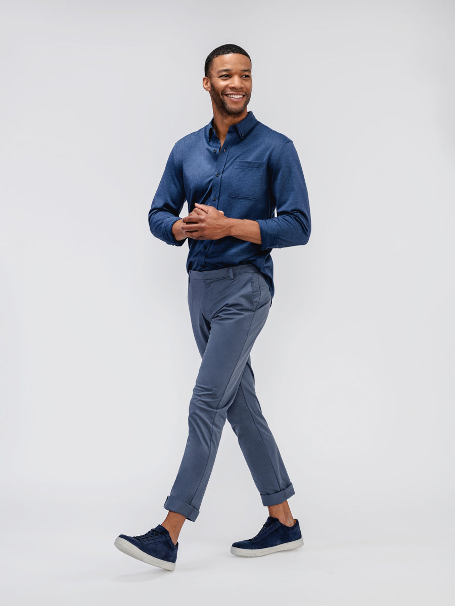 Men's Indigo Stripe Hybrid Button Down and Indigo Heather Kinetic Tapered Pant on model walking left