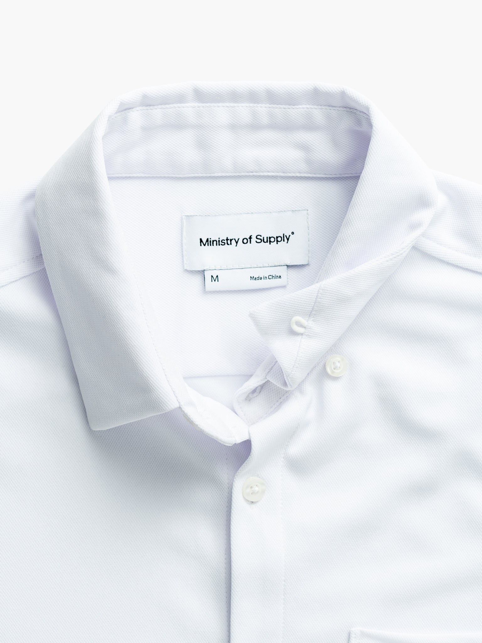 men's white apollo short sleeve sport shirt zoomed shot of hidden collar buttons