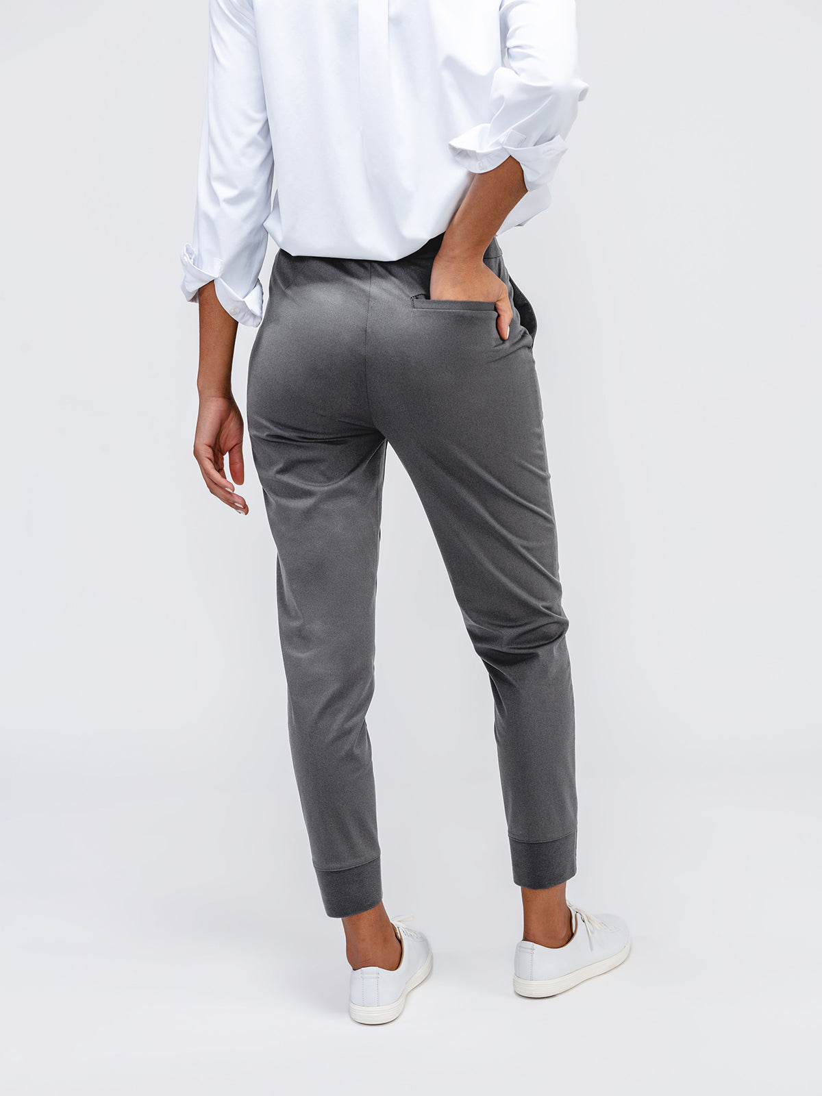 Women's Slate Grey Kinetic Pull On Pant on model facing backwards with hand in pocket