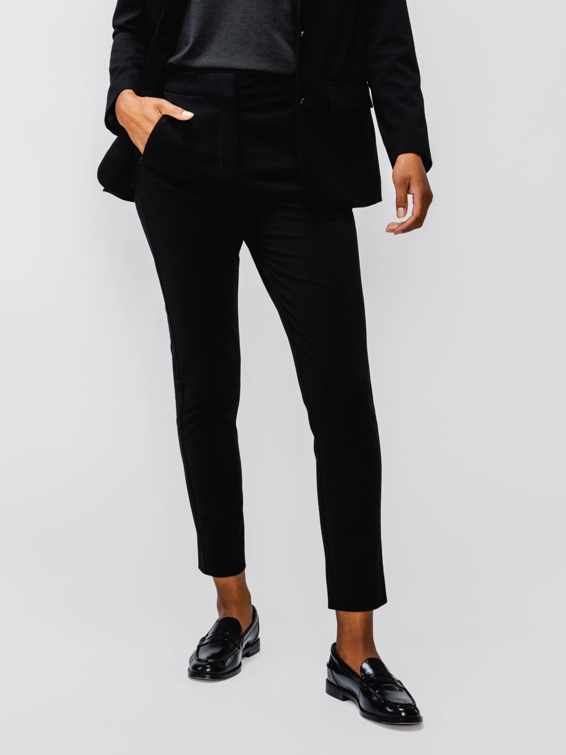 model wearing womens velocity oversized blazer black and womens velocity tapered pant black in studio